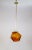 A 1970s pendant light in the form of an icosahedron- a 20-sided polyhedron. Made of amber-orange glass with a striped...