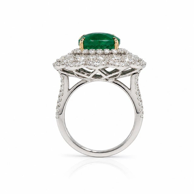 An extraordinary 18K white gold ring showcasing a GIA-certified natural Zambian cushion-cut emerald weighing 7.00 carats,...