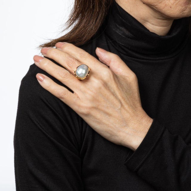 Vintage Tiffany & Co large pearl ring crafted in 18k yellow gold (circa 1990s). Large freeform cultured pearl measures...