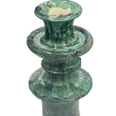 A Moroccan Tamegroute glazed candlestick holder is a handcrafted piece made in the historic pottery village of Tamegroute...