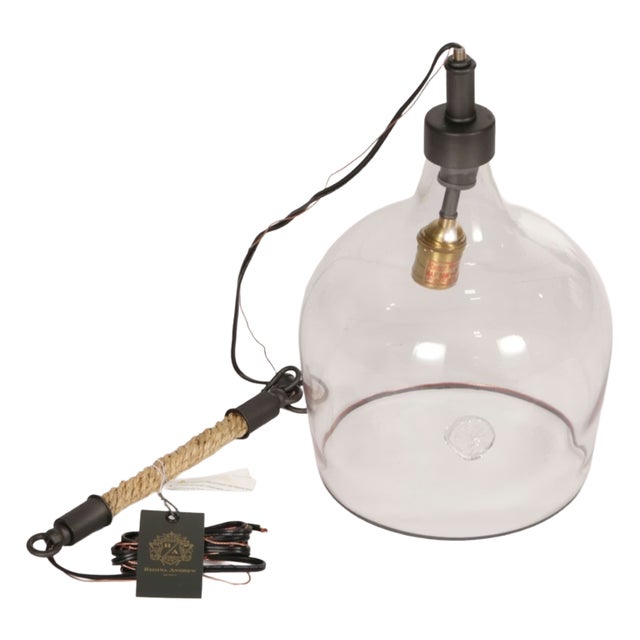 Beautiful in its simplicity. Elegant, yet rustic. Clear glass globe, black and brass highlights with a sisal rope wrapped...