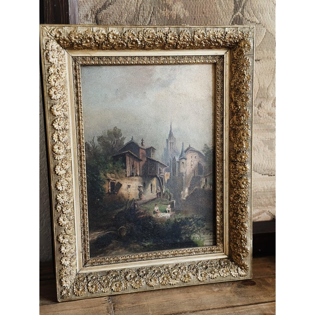 A beautiful antique oil featuring a village hillside scene. overall: 17.75" x 14" visible art: 13.25" x 9.25"