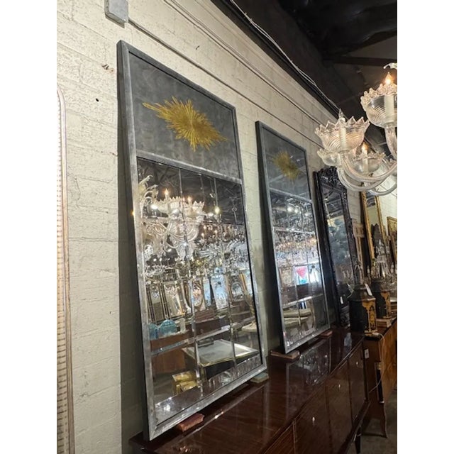 Great pair of Maison Jansen manner eglomise' sunburst trumeau mirrors. Jansen manner églomisé mirrors are prized for their...