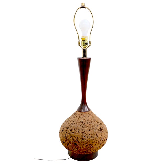 Impressive pair of cork and wood table lamps, in very good original, clean and working condition. The lamp bodies are...