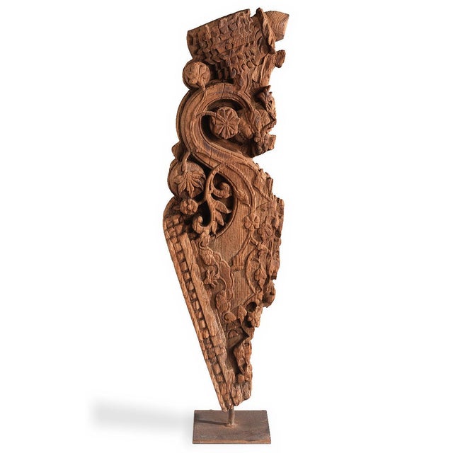 A characterful hand-carved wooden fragment from South India, depicting a stylised yali—the mythical guardian figure long...