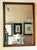 Early 20th century American Federal Revival wall mirror featuring a solid wood frame with a warm medium brown finish that...