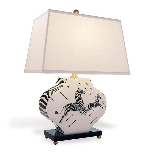 Zebra is our modern shaped classic lamp. The cream/white crackle porcelain is accented with Scalamandre's iconic zebra...