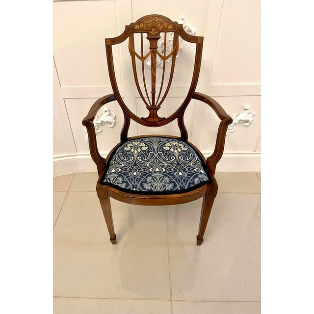 Fine quality antique mahogany inlaid desk chair having a fine quality mahogany inlaid shield shaped back inlaid with...