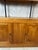 An elegant 1980s bookcase, combining warm-toned wood with slender black metal uprights. Its clean lines and open structure...