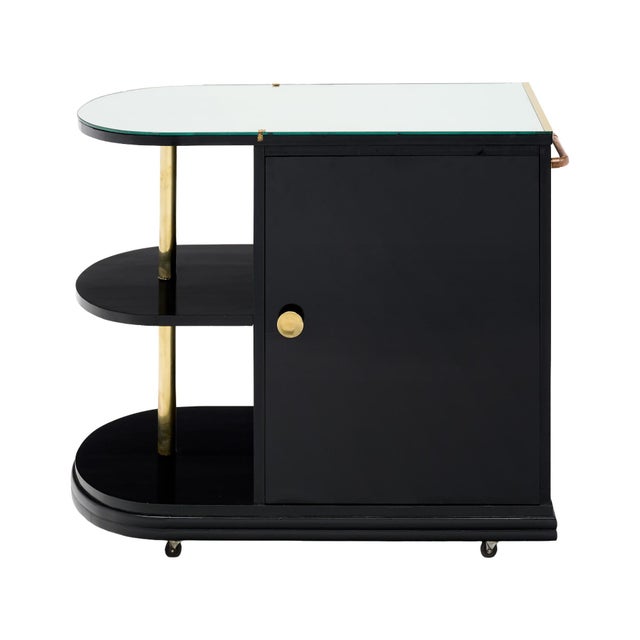 An elegant and highly functional French Art Deco bar cart, circa 1940, distinguished by its sophisticated architectural...