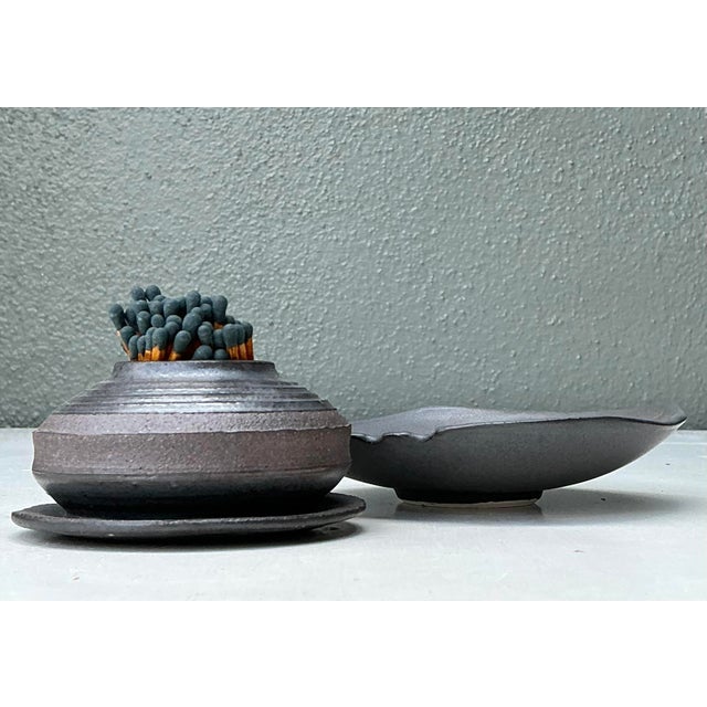 This exceptional two-piece studio pottery set is a masterclass in Brutalist texture and functional design, celebrating the...
