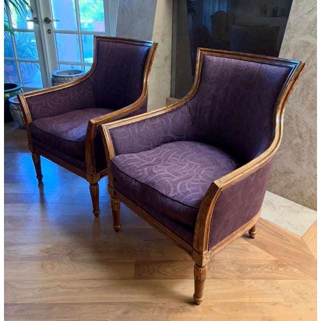 TWO (2) French Louis XVI-style Bergere Chairs in custom purple tamesa silk with paint/gilt wood detailing finish.