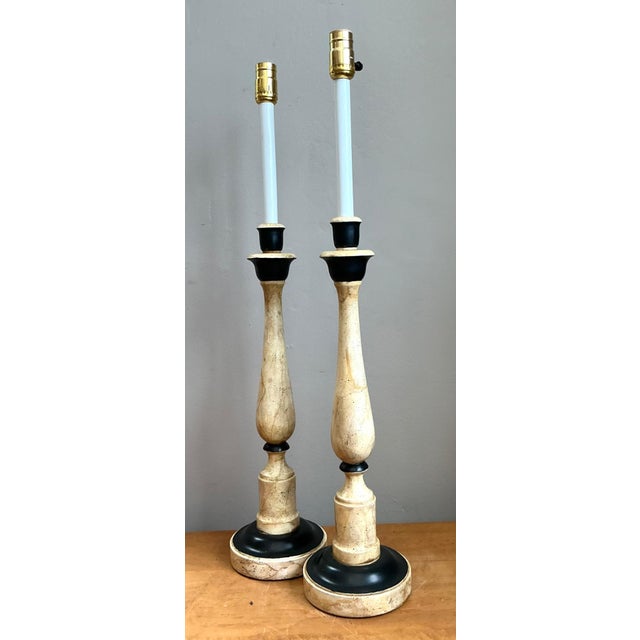 This elegant pair of vintage candlestick lamps exemplifies the refined craftsmanship and timeless aesthetic associated...