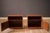 Vintage pair of nightstand end table cabinets in rosewood, made in Denmark circa 1970's. This set features natural rich...