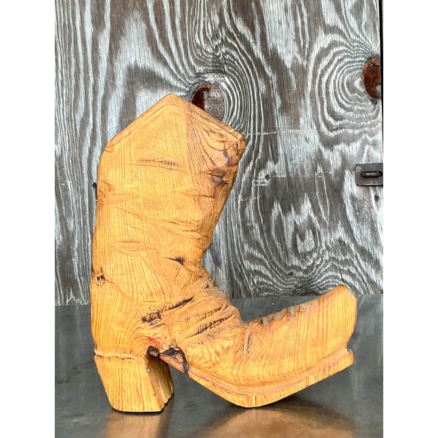 Discover a truly unique piece of signed folk art with this captivating vintage hand-carved wooden boot, skillfully crafted...