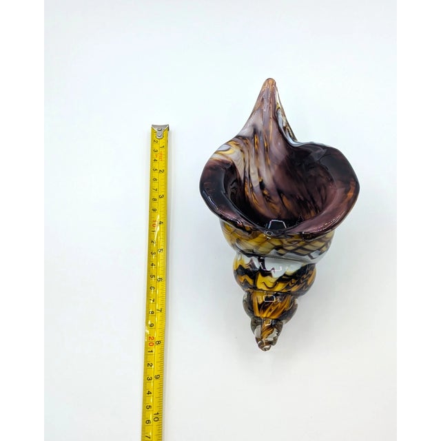 Add a striking touch of vintage Italian-inspired artistry to your décor with this beautiful Murano-style blown glass conch...