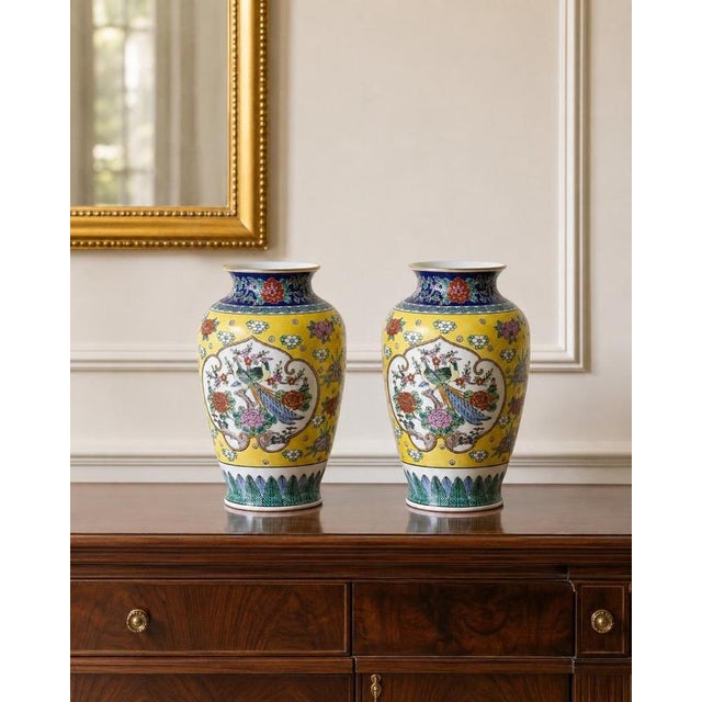 An exceptionally decorative pair of japanese gold imari porcelain vases, hand-painted in arita, japan, circa 1960s. Both...