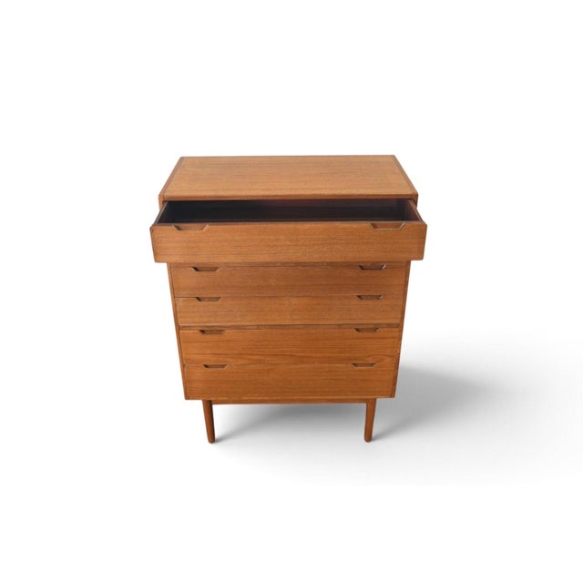This highboy was designed by Svend Langkilde and produced by Langkilde Møbler in Denmark during the 1960s. The teak case...