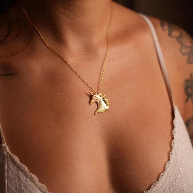 Embrace the magic with the Majestic Unicorn Aura Gold Pendant Chain Necklace. Crafted with 18k gold plating on sterling...