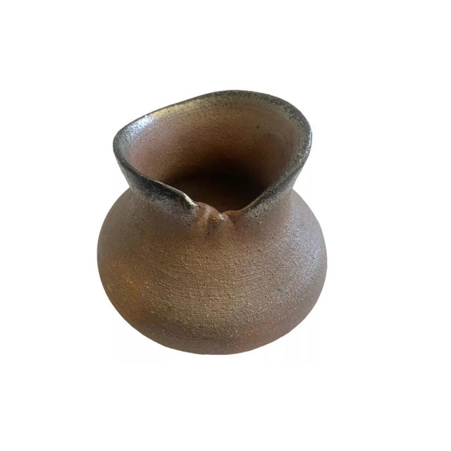 we have for your consideration a very beautiful mid century modern studio art pottery. this piece of pottery consists of a...