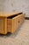 1970s low coffee table featuring a rectangular bamboo structure, smooth top and drawer fronts covered in woven rush....