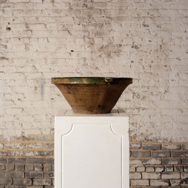 Add warmth and artisanal character to your space with this 20th century Spanish ceramic bowl, featuring a rich golden...