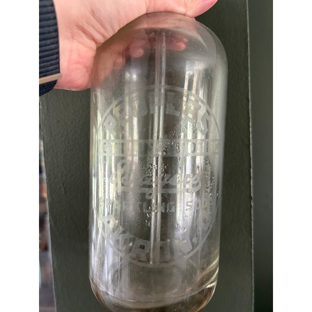 Vintage seltzer bottle from Akron Ohio. Nice clear/white decal! Top mechanism is metal. Nice decoration piece! Unsure of...