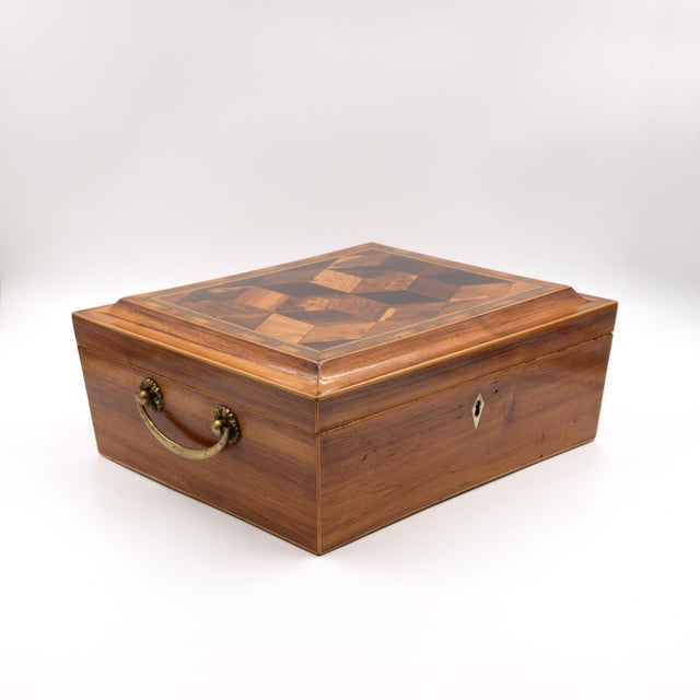 Regency Period; English specimen wood box, circa 1830. The plumwood case is surmounted by a hinged lid with a tumbling...