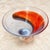 Hand-blown Swedish art glass bowl from the Kosta Boda Twister series, signed and numbered by designer Kjell Engman on the...