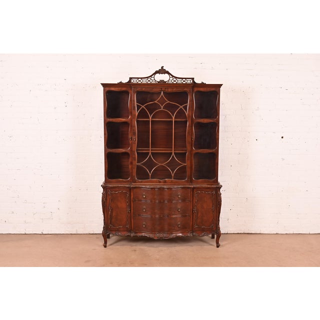 A beautiful antique French Provincial Louis XV style breakfront bookcase cabinet or dining cabinet By Romweber USA, Circa...