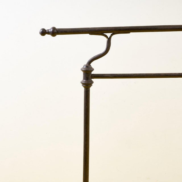 Discover the timeless elegance of this wrought iron drying rack, a perfect example of industrial design. Featuring a...