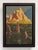 The artwork depicts a rugged mountain landscape bathed in warm, golden light, highlighting the dramatic peaks and rocky...
