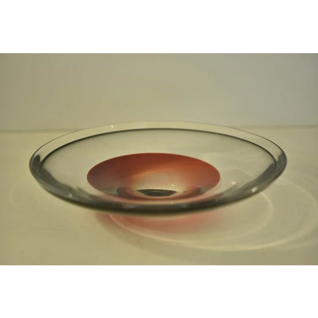 A very nice centerpiece bowl handmade art glass at Swedish Orrefors and most likely designed by Sven Palmqvist. The bowl...