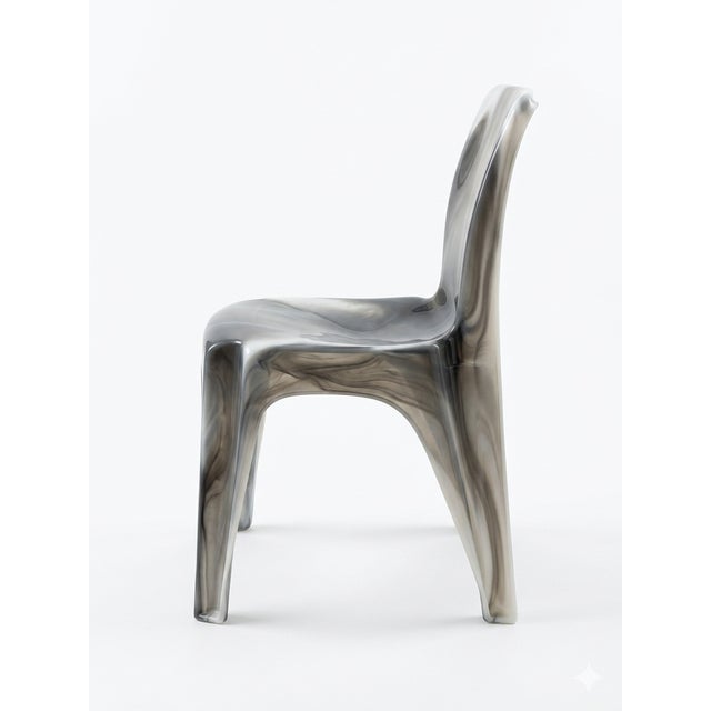 A rare and visually striking Sebel chair featuring a translucent marbled resin body with smoky grey veining and subtle...