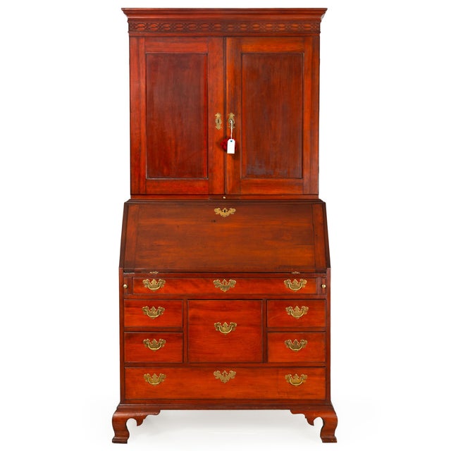 AMERICAN CHIPPENDALE CHERRY SECRETARY DESK AND BOOKCASE With "American Independence" leather faux-bookends Probably...