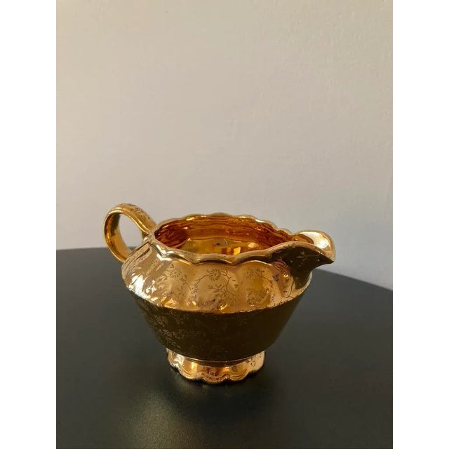 A beautiful American 22K gold-plated porcelain creamer milk pitcher, circa early-20th century, USA, by Taylor Smith &...