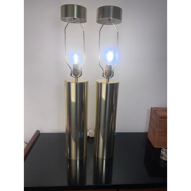 Robert Sonneman like lamps Hollywood regency 70’s cylinder brass finish lamps with matching finals. Very simple and...