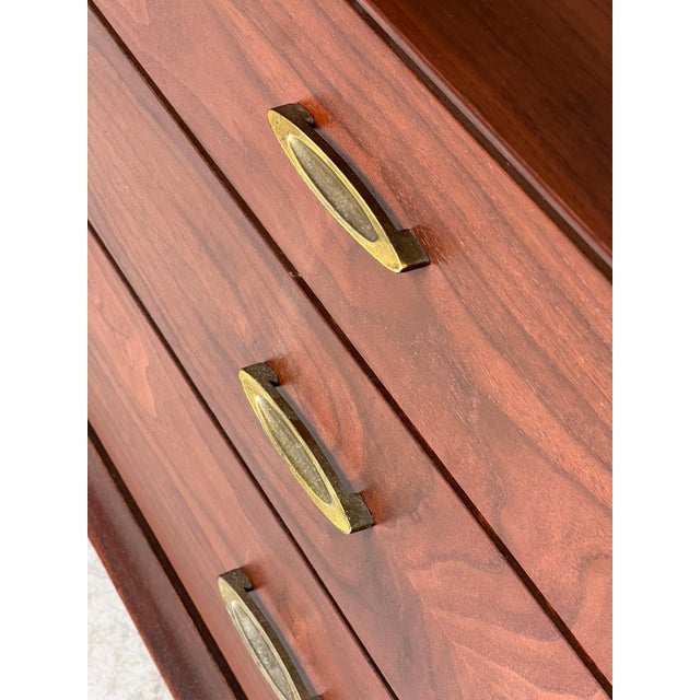 Beautifully refinished walnut dresser by United Furniture. Nine drawers move fluidly, accented with brass pulls. In...