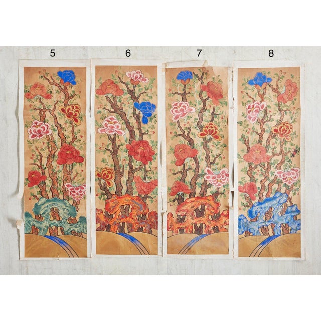 Vintage Chinese hand painted watercolor on paper featuring vibrant floral designs. This piece was acquired from a...