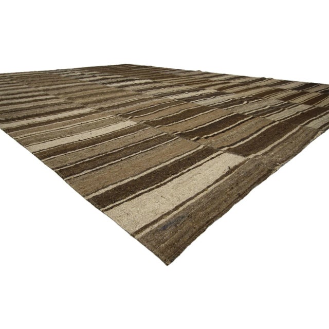 60633 Vintage Turkish Kilim Rug with Earth-Tone Colors, 10'09 x 14'10. Wabi-Sabi embraces rustic finesse in this handwoven...