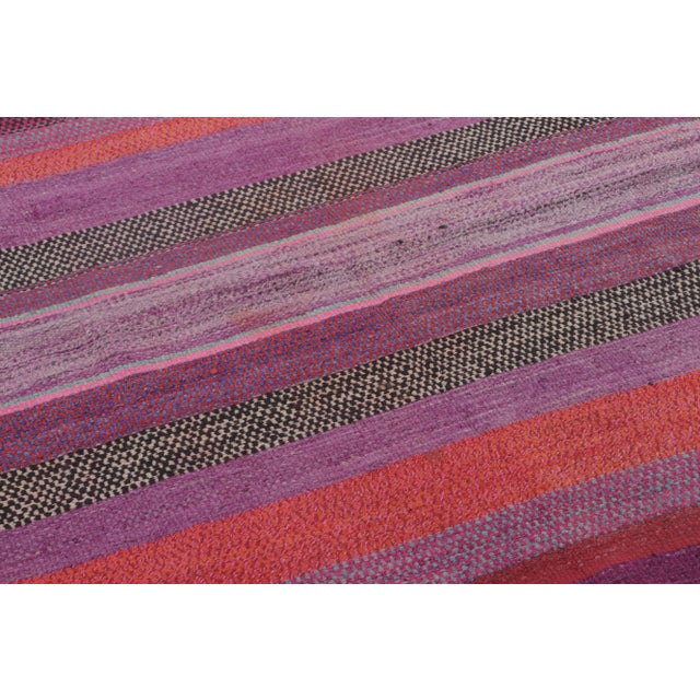 Handwoven in wool circa 1950–1960, this 5x5 vintage Kilim, woven in the tradition of a Frazada textile, is a vivid example...
