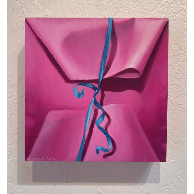 This artwork presents a close-up view of a pink package, its vibrant hues creating a sense of warmth and playfulness. The...