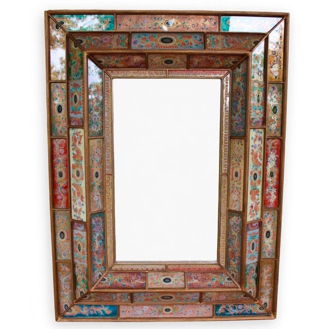 Gorgeous large wall mirror by New York artist Robert Weiss was hand-made by Peruvian artisans through the reverse painting...