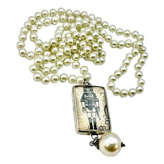 1990s Vintage Chippendale Art Deco Nutcracker Babble on Faux Pearls Christmas Pendant Necklace, 40” For Sale