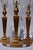 Two sets of matching stifle style brass lamps with four matching harps and four matching finals. These column lamps have a...
