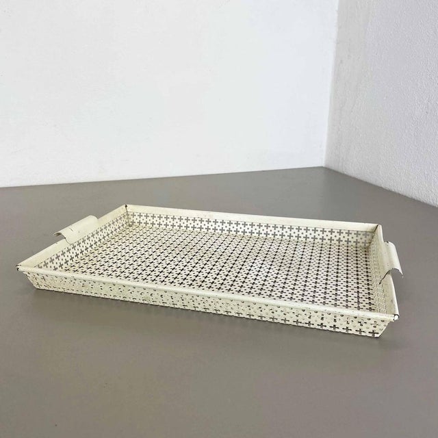 Metal tray. Designed and produced by Mathieu Matégot. Origin: France, 1950s. Original Mathieu Matégot tray "RIGITUELLE"....