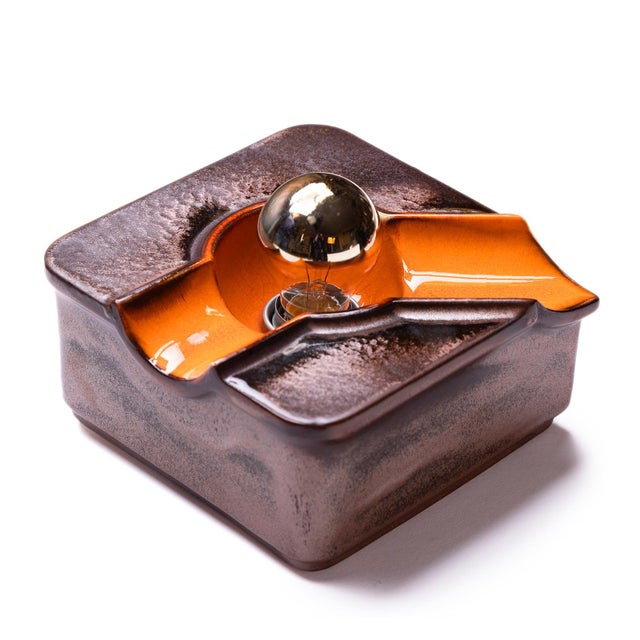 Offered is an unusual, square ceramic wall lamp from the famous german company goebel from the 1970s. The surface of the...