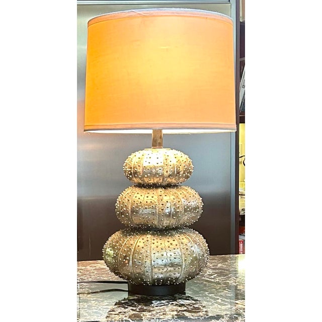 If you live by water OR wished that you lived by the water, this stacked, sea urchin, textured lamp is a wonderful...