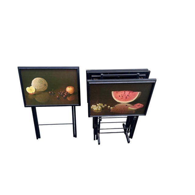 Vintage Set of Four Mid-Century Folding TV Tray Tables With Stand and Fruit Still-Life Motifs A charming set of four...
