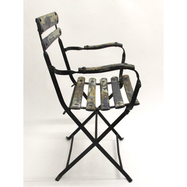 French-style garden chair with armrests, child-sized. Works.